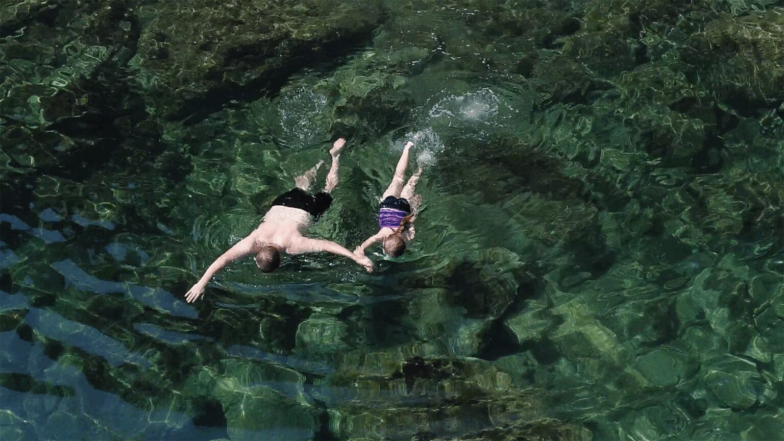 Snorkeling in clear water during a Portofino boat trip